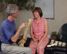Dr. Cooper shows Andi a representation of the human spine